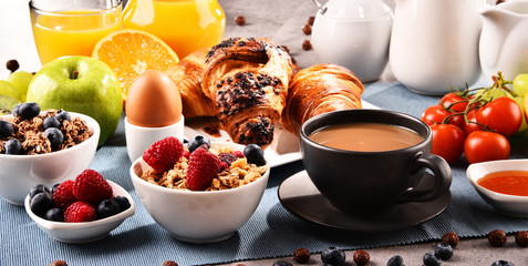 Breakfast served with coffee, juice, croissants and fruits