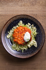 Salmon burgers nestled on a bed of coleslaw. Salmon fish cake. View from above, top