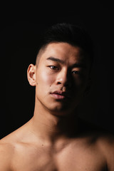 Obraz premium Portrait of young asian boy with fitness body.