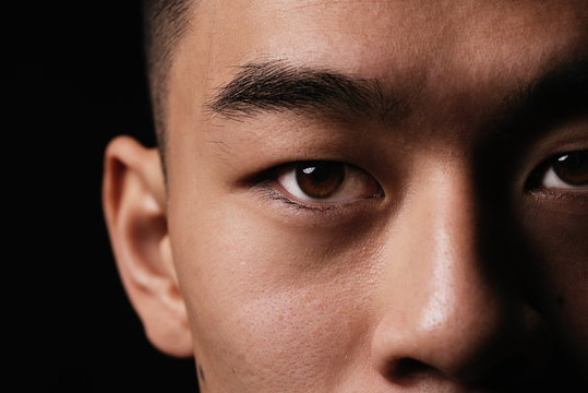 Close detail of the eye of asian man.