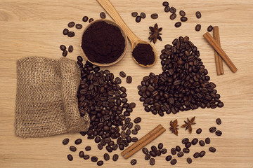 Coffee beans and ground coffee. Heart made of coffee beans. Toning.