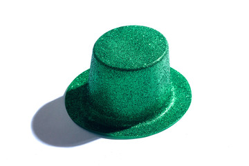 A close up of a sparkly green St.Patrick's Day hat on white studio background