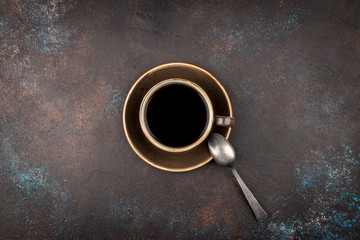 Cup of coffee on a rusty background