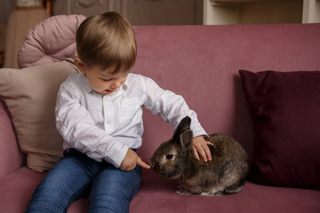 Happy Easter. Child and easter bunny at Easter day