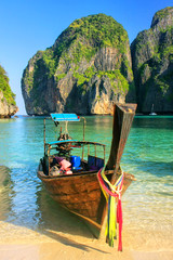 Longtail boat anchored at Maya Bay on Phi Phi Leh Island, Krabi Province, Thailand