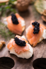 Canapes with smoked salmon and caviar