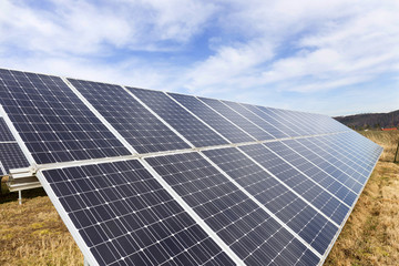 Solar Power Station on the early spring Meadow 