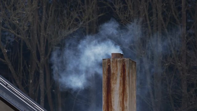 Smoke rising from old chimney