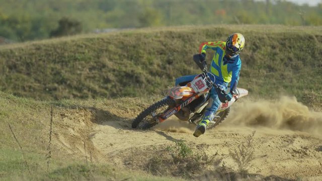 Rider on a motocross leaving dust behind