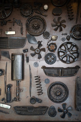Fototapeta na wymiar Set of old car parts on the wall in workshop