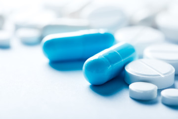 Pharmacy theme, blue medicine tablets.