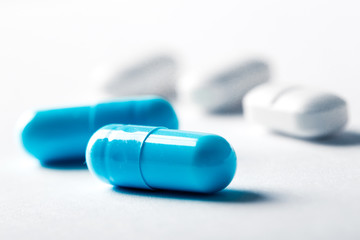 Pharmacy theme, blue medicine tablets.