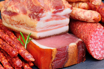 Group of sausages on slate