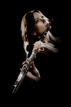 Flute player. Flutist playing flute music instrument