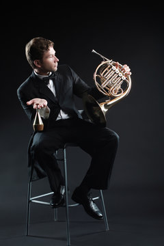 French horn player classical musician portrait