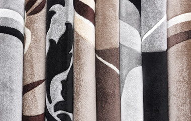Carpets variety selection rolled up rugs shop store