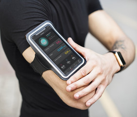 A man wearing a smartphone armband
