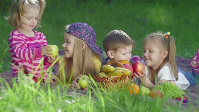 Children playing with fruits