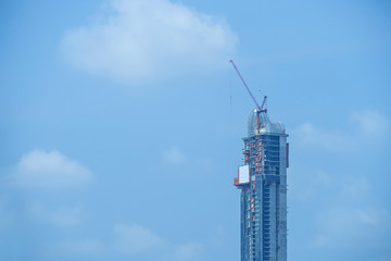 building site with cranes and blue sky