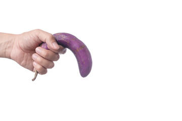 Hand holding old purple eggplant as a symbol of sexual dysfunction