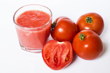 Fresh tomato juice isolated on white background