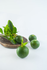 Lime. Fresh fruit with leaf isolated on white background.
