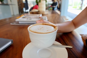 Coffee cup hot on wooden table in the morning 