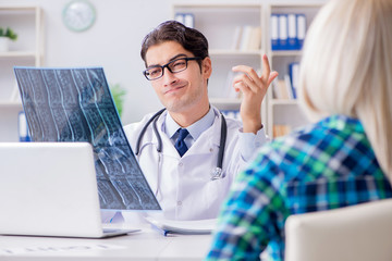Doctor examining x-ray images of patient