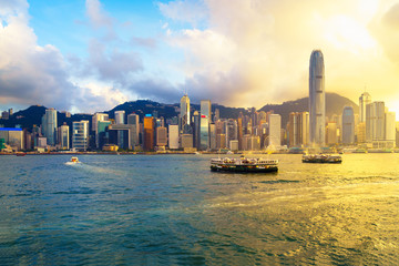 Hong Kong skyline at sunset over Victoria Harbour