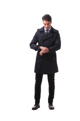 Young businessman wearing winter coat isolated on white