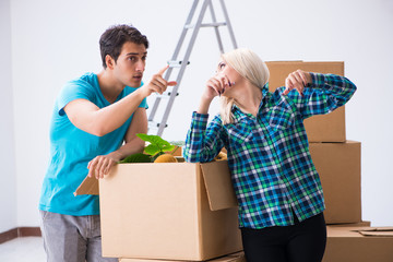 Young family moving in to new apartment