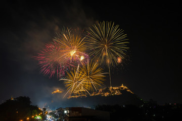 Fototapeta na wymiar Landscape Scene of multicolor Fireworks annual festival over the Phra Nakhon Khiri (Khao Wang) which is ancient one of the landmark in Phetchaburi Province Thailand. Celebration concept