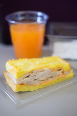 Sandwich and orange juice in an airplane