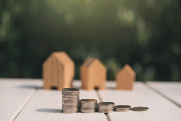 Saving to buy a house or home savings concept with money coin stack growing.Saving money concept.