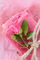Rose Handmade Soap.Soap with Rose Extract. handmade soap pink with roses on pink crumpled paper. Organic  Cosmetics Concept.Natural vegan soap with rose fragrance
