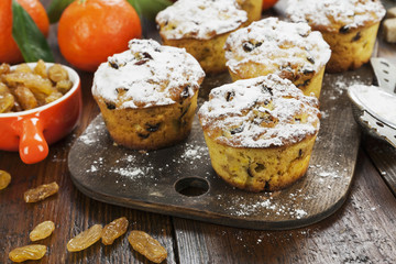 Mandarin muffins with raisins on the table