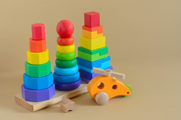 Learning developmental kids toys.  Geometric stacker, organic wooden baby toys. Copy space