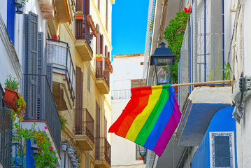 Fototapeta na wymiar City views and gay flags on buildinds in a small town in the out