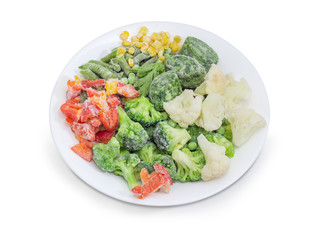 Various frozen vegetables on the white dish closeup