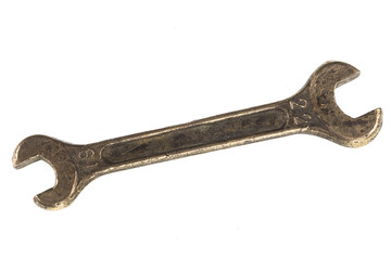 old copper wrench for nuts on white isolated background