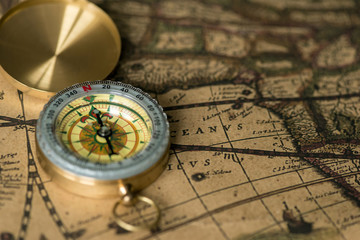 Old compass on vintage map