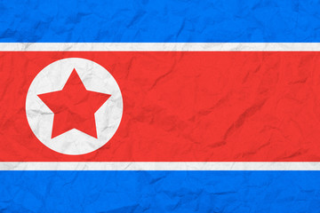 Flag Of North Korea. Vintage style. Old wall texture. Faded background.