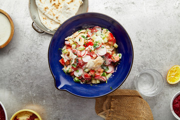 Overhead image of traditional jewish and middle eastern dish fattoush. Israeli cuisine concept
