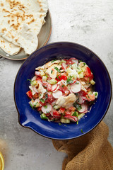 Overhead image of traditional jewish and middle eastern dish fattoush. Israeli cuisine concept