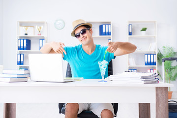 Businessman preparing for vacation in the office