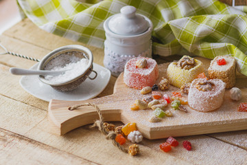 East sweets with fruits, nuts and sugar powder
