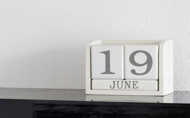 White block calendar present date 19 and month June