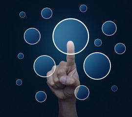 Hand pushing blank circle virtual screen button over blue background