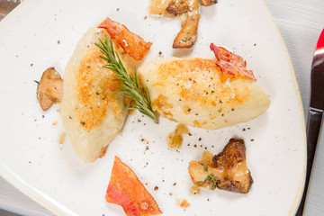 Traditional polish dish called kartacz - potato dumplings stuffed with meat and served with crispy...