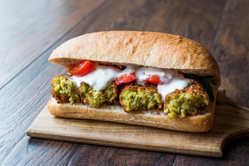 Chickpea Falafel Sandwich with Tomatoes and Sauce